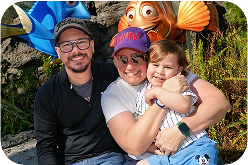 Joe with wife and son at Epcot